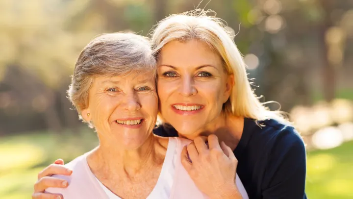 image of two women smiling together