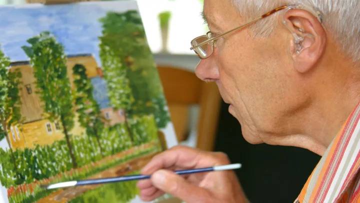 elderly man painting